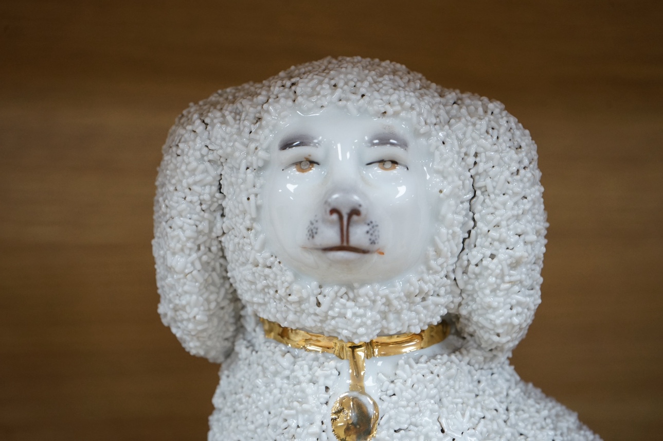 A pair of Continental porcelain models of Poodles a similar smaller pair and a pair of late Staffordshire sheep. Large poodles 23cm high. Condition - one leg on large Poodle broken and reglued